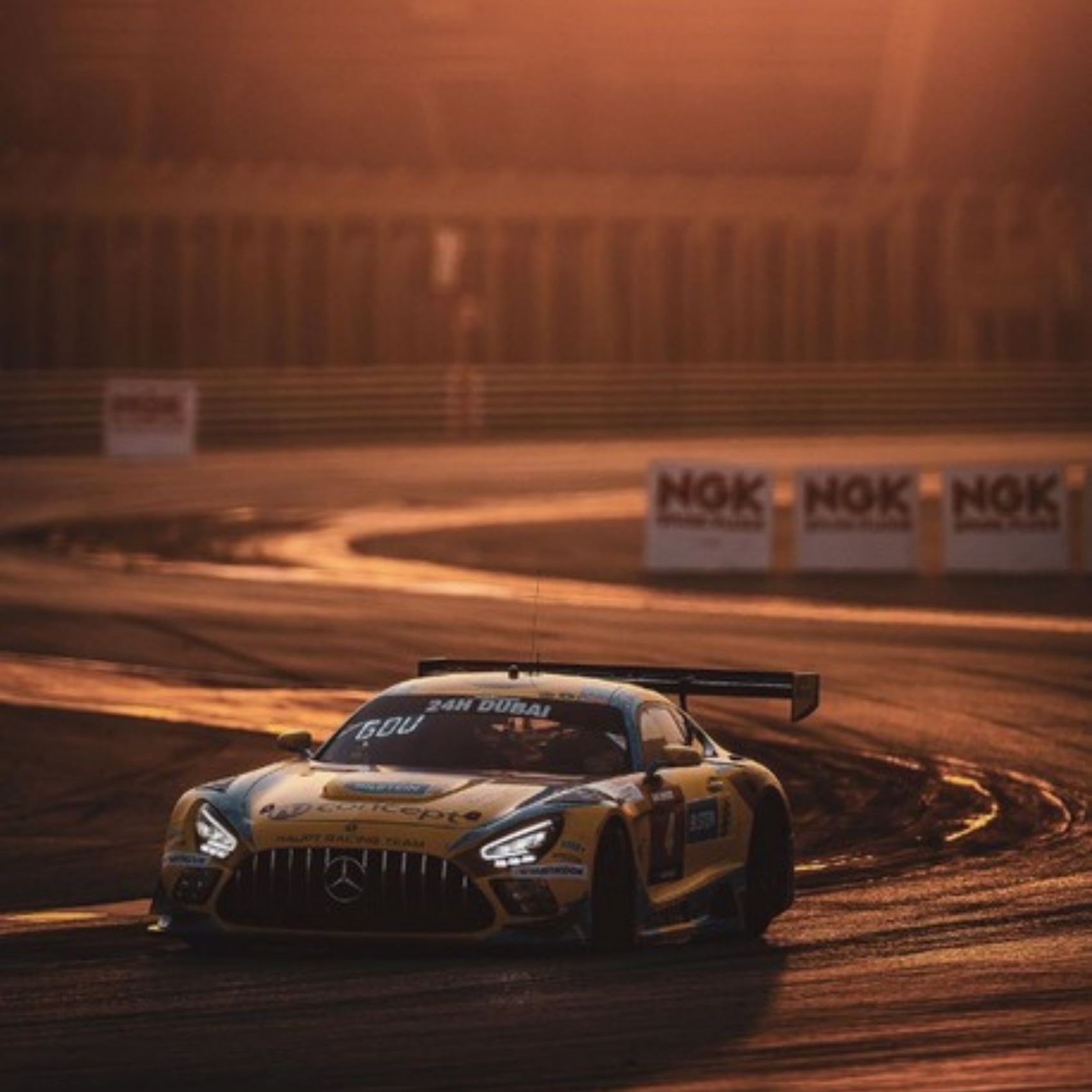 Mercedes-AMG GT3 race car at golden hour during the 24H Dubai – automotive social media management UAE by Stache DXB Media