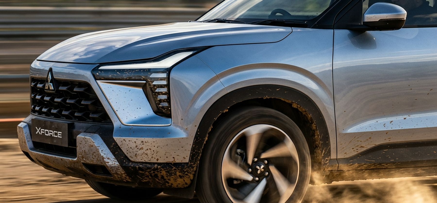 Mitsubishi XFORCE kicking up dust on a dirt track – campaign-ready automotive content Dubai